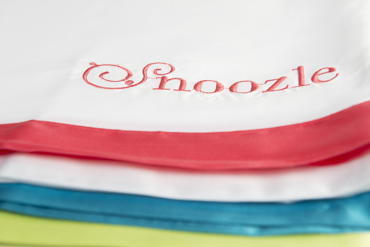 Close-up of the embroidered Snoozle logo and coloured trims